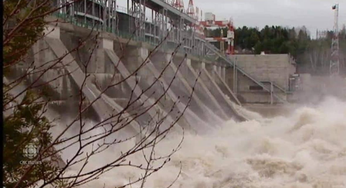 roger-jenkins-first-person-dam A large runoff and waves churning at the base of a dam.Â
