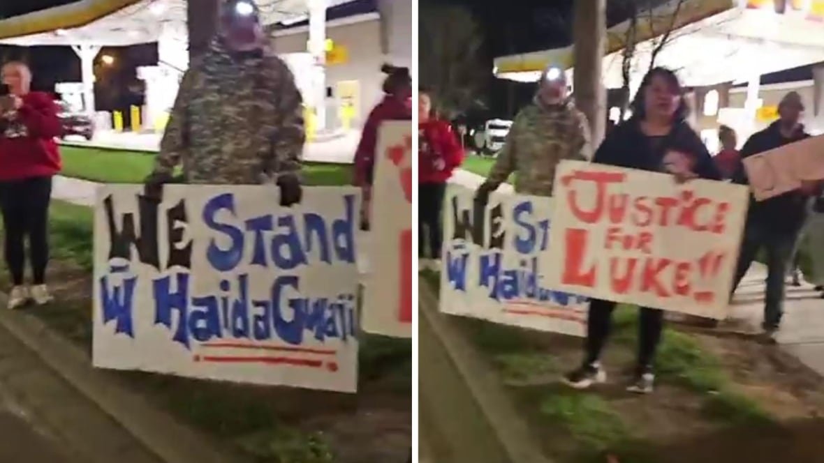 People in the dark with signs that read, We stand with Haida Gwaii and Justice for Luke.