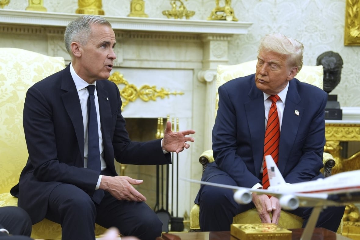 trump-and-carney-oval-office-1 Two mean sit in an ornate room.