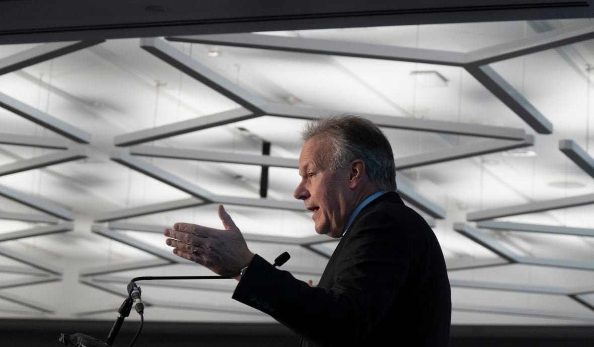 A man stands at a podium.
