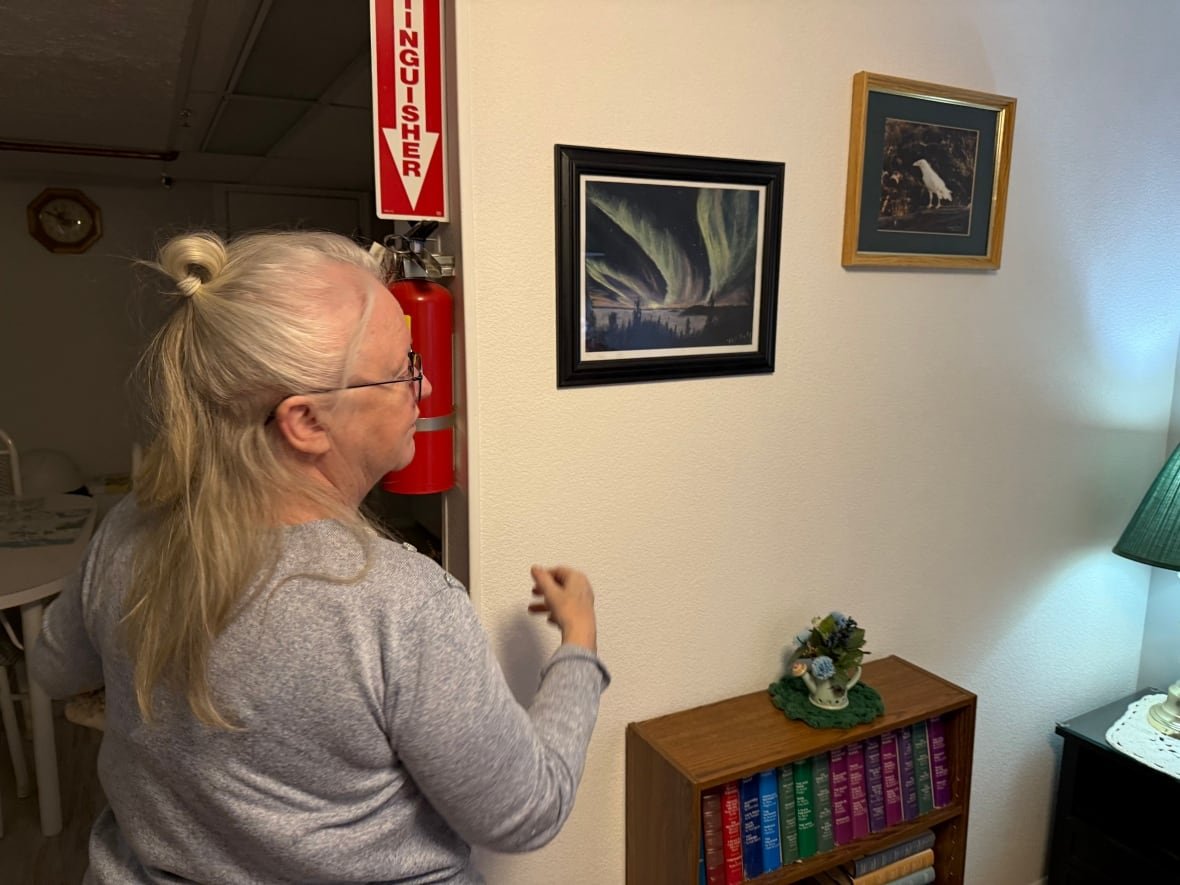 faith-embleton-1 A woman looks at art.