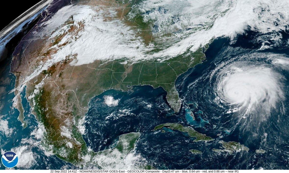 tropical-weather-hurricane-fiona-satellite A satellite image shows a white swirling circle approaching the East Coast of the United States.