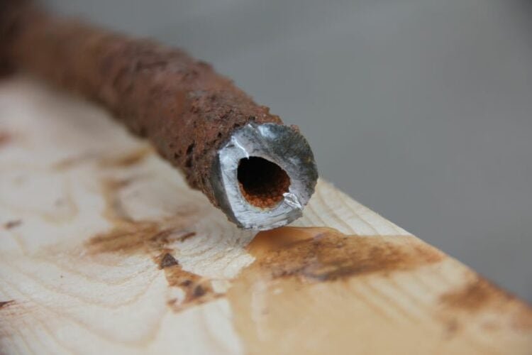 A close-up of a lead pipe.
