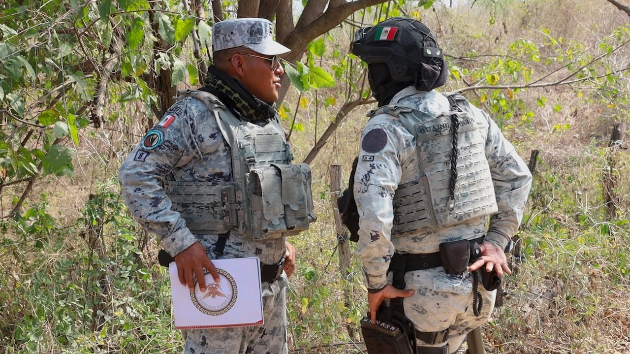 Two soldiers speaking together.